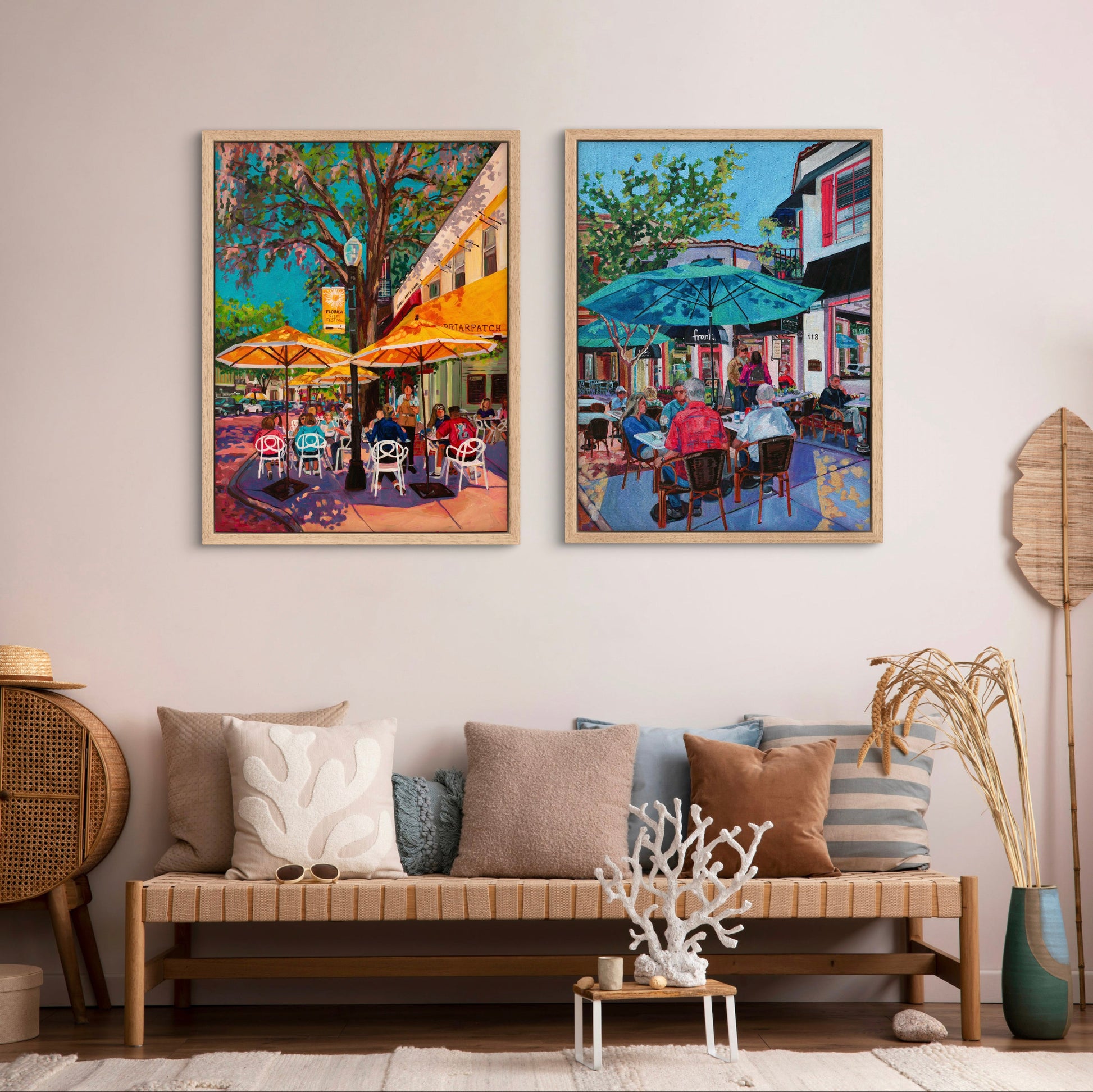 entryway with bench and pillows and two vibrant modern street scene paintings.
