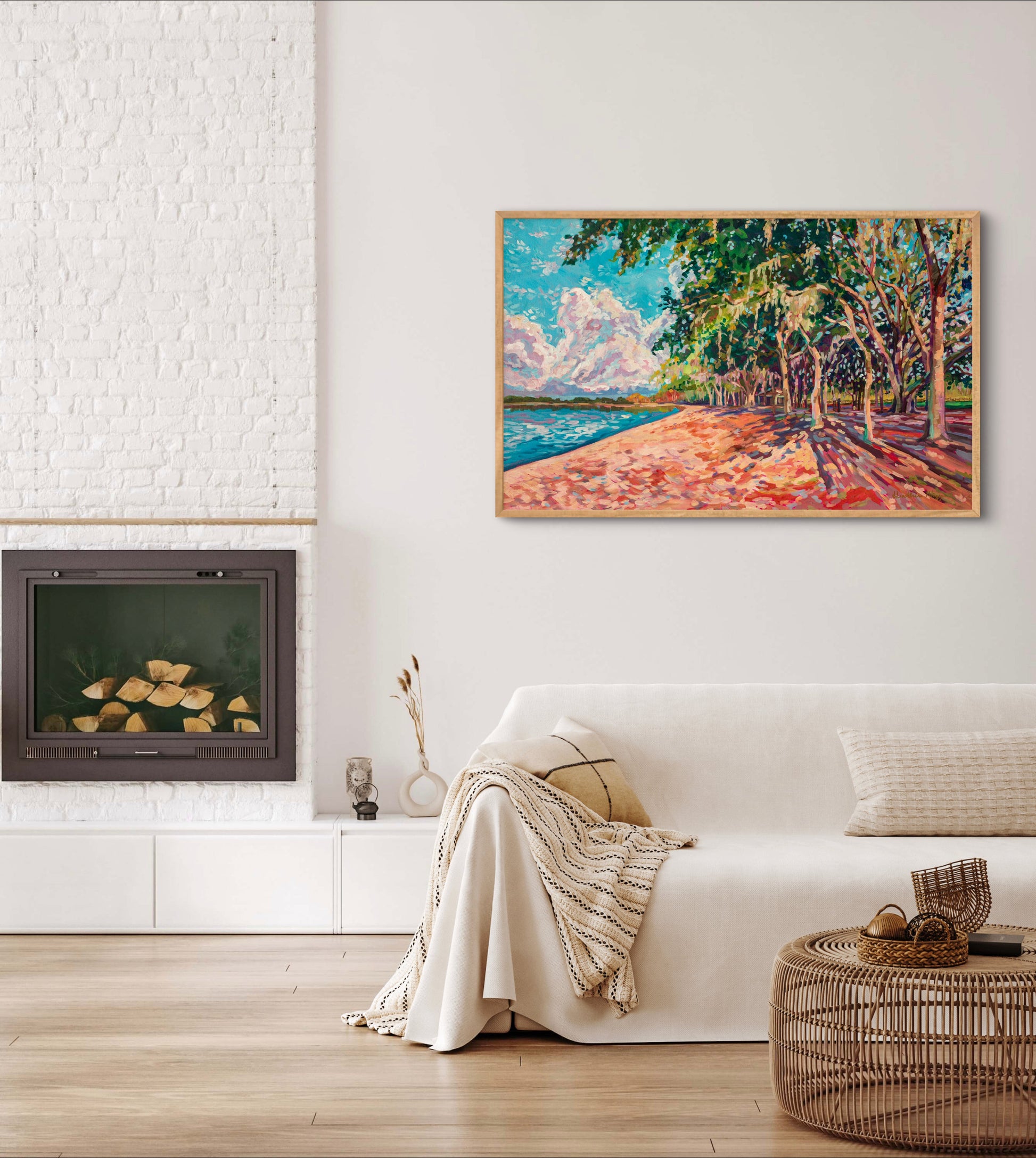 white/cream neutral living room with couch and fireplace, large colorful modern impressionist landscape painting on wall of Chisholm Park.