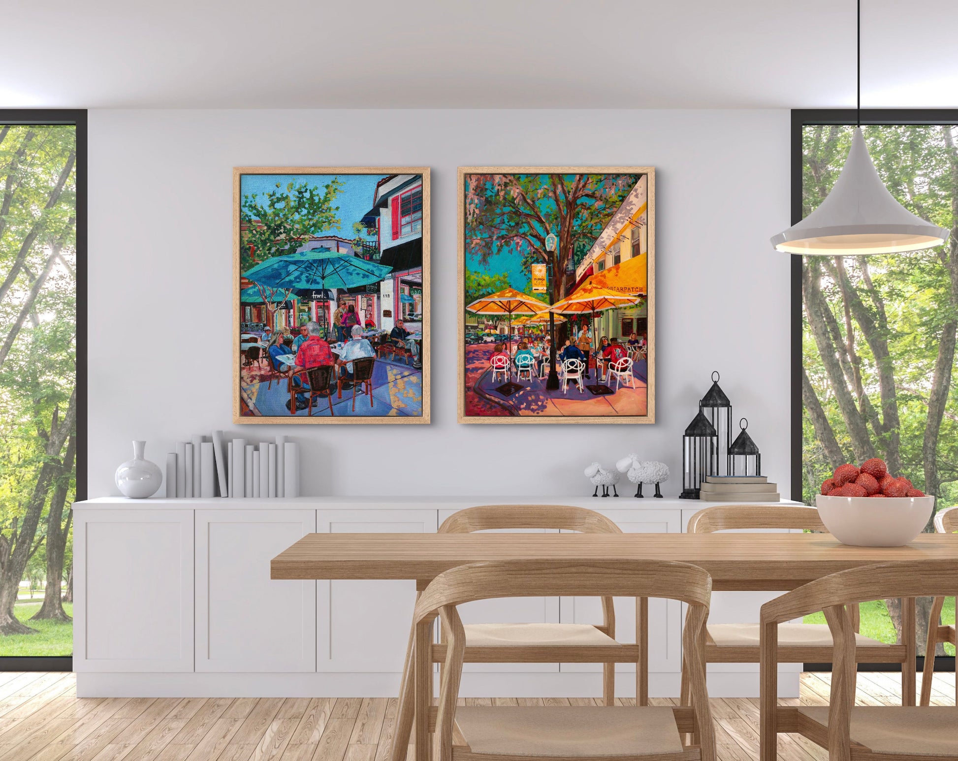 Bright modern dining area with table and shelves and two vibrant outdoor cafe scene paintings of people dining in Winter Park Florida.