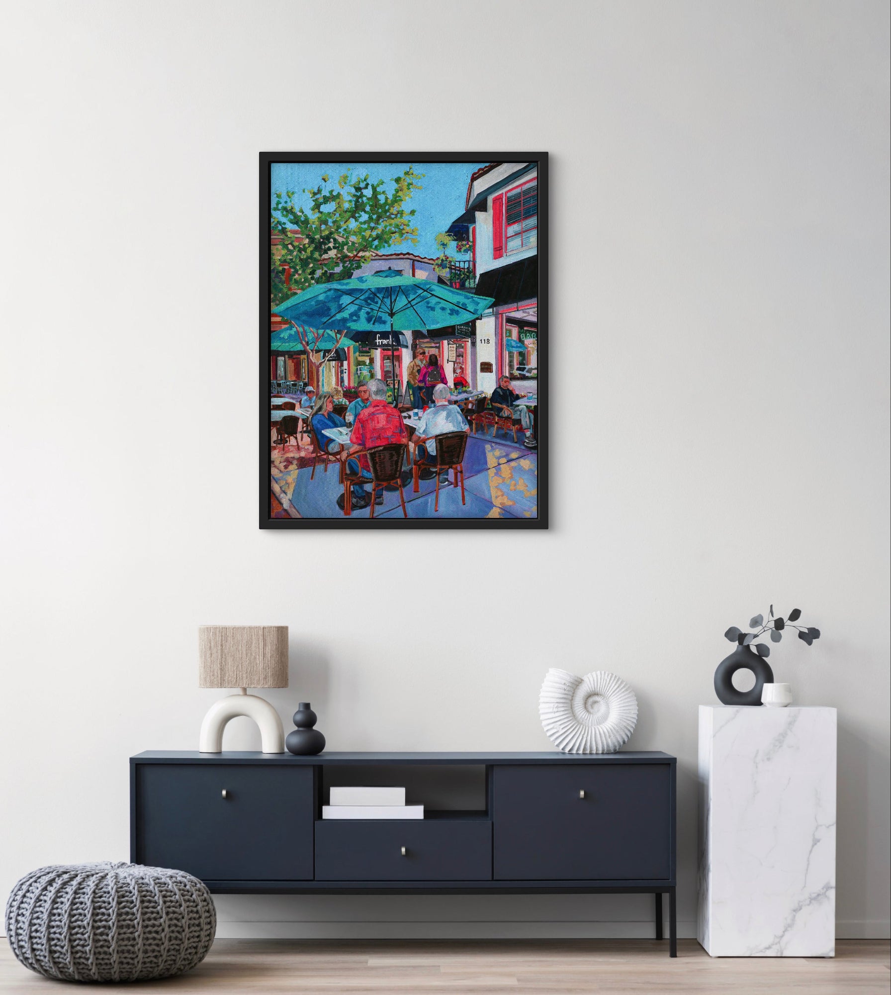 modern credenza and decor with a vibrant lively city sidewalk cafe scene.