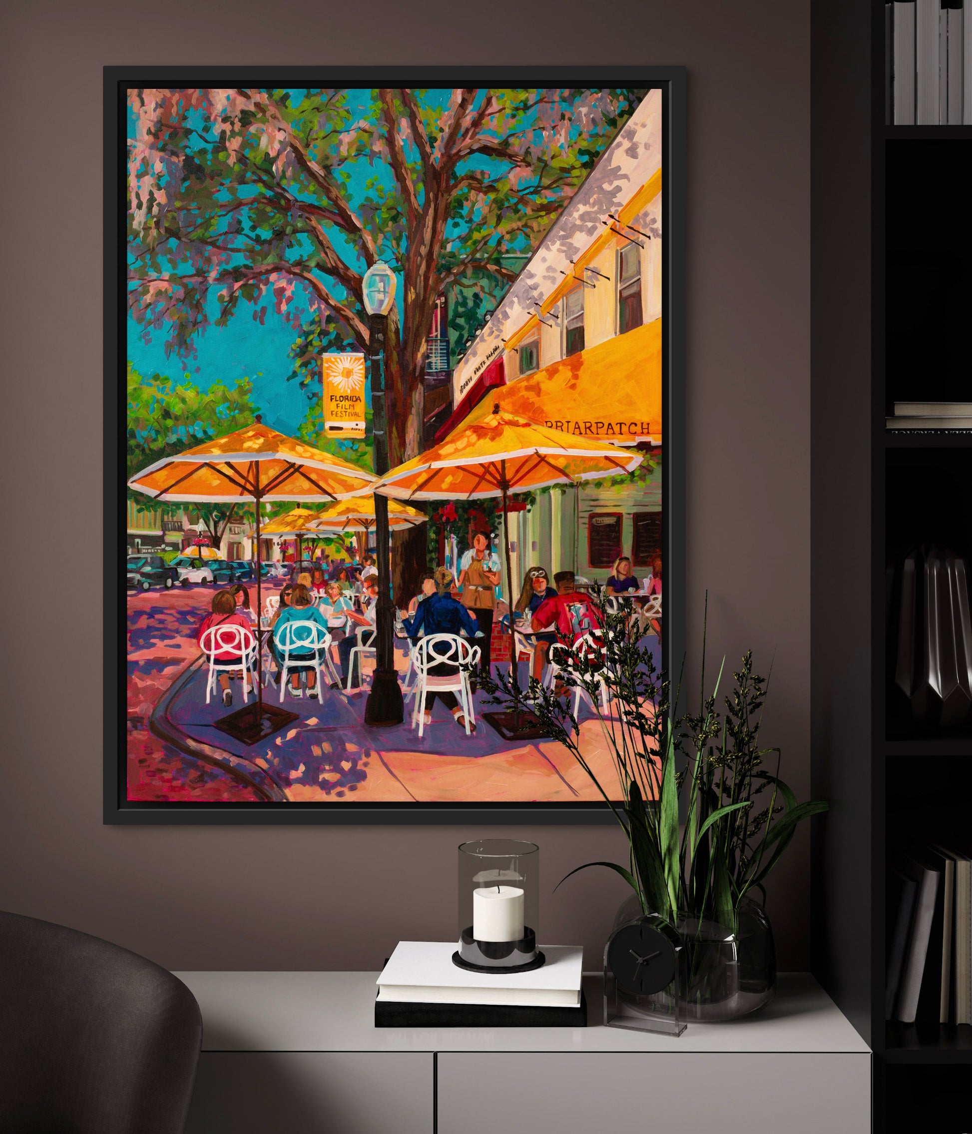 Outdoor cafe painting in cozy office space.
