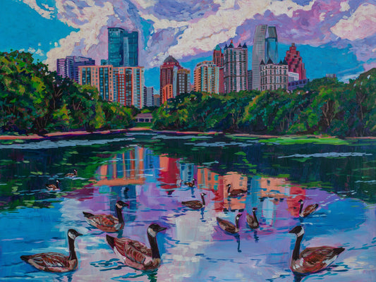 skyline of Midtown Atlanta as seen from lake in Piedmont Park.