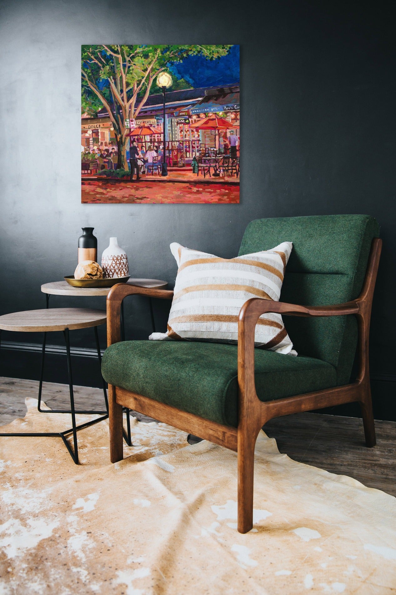 painting on wall with chair and table: Vibrant nightscene painting of outdoor cafe with tables and trees dramatic lighting, Winter Park Nightlife scene 3, umbrellas and tables and tree