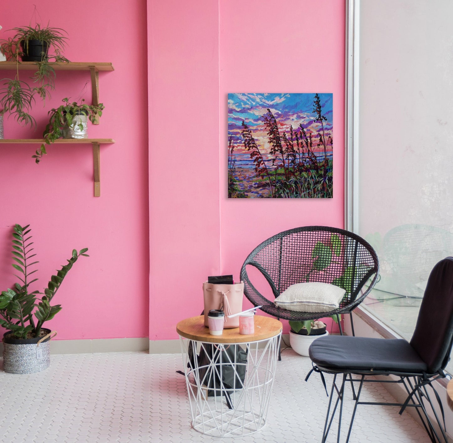 sunrise beach scene in pink room with chiars