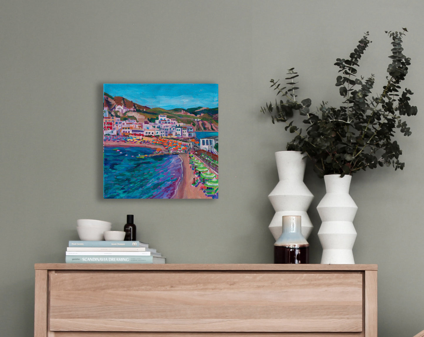 small Italian painting on wall with dresser