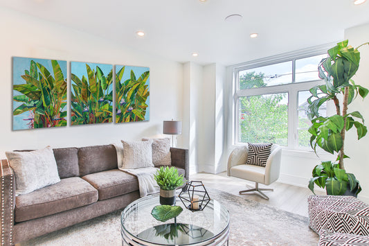 statement piece triptych of bird of paradise in a bright white living room