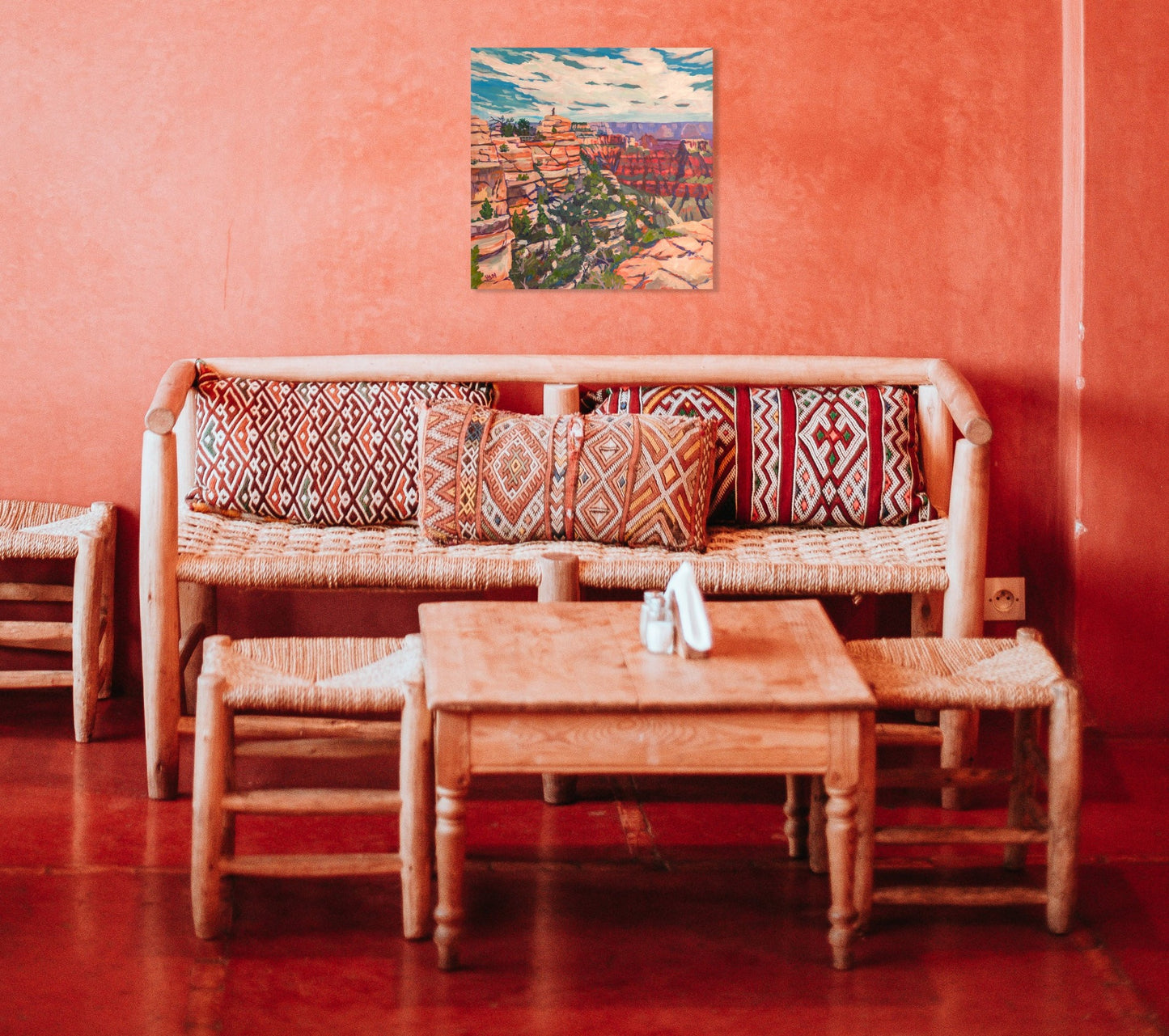 Southwest decorated room with painting of the grand canyon on the wall
