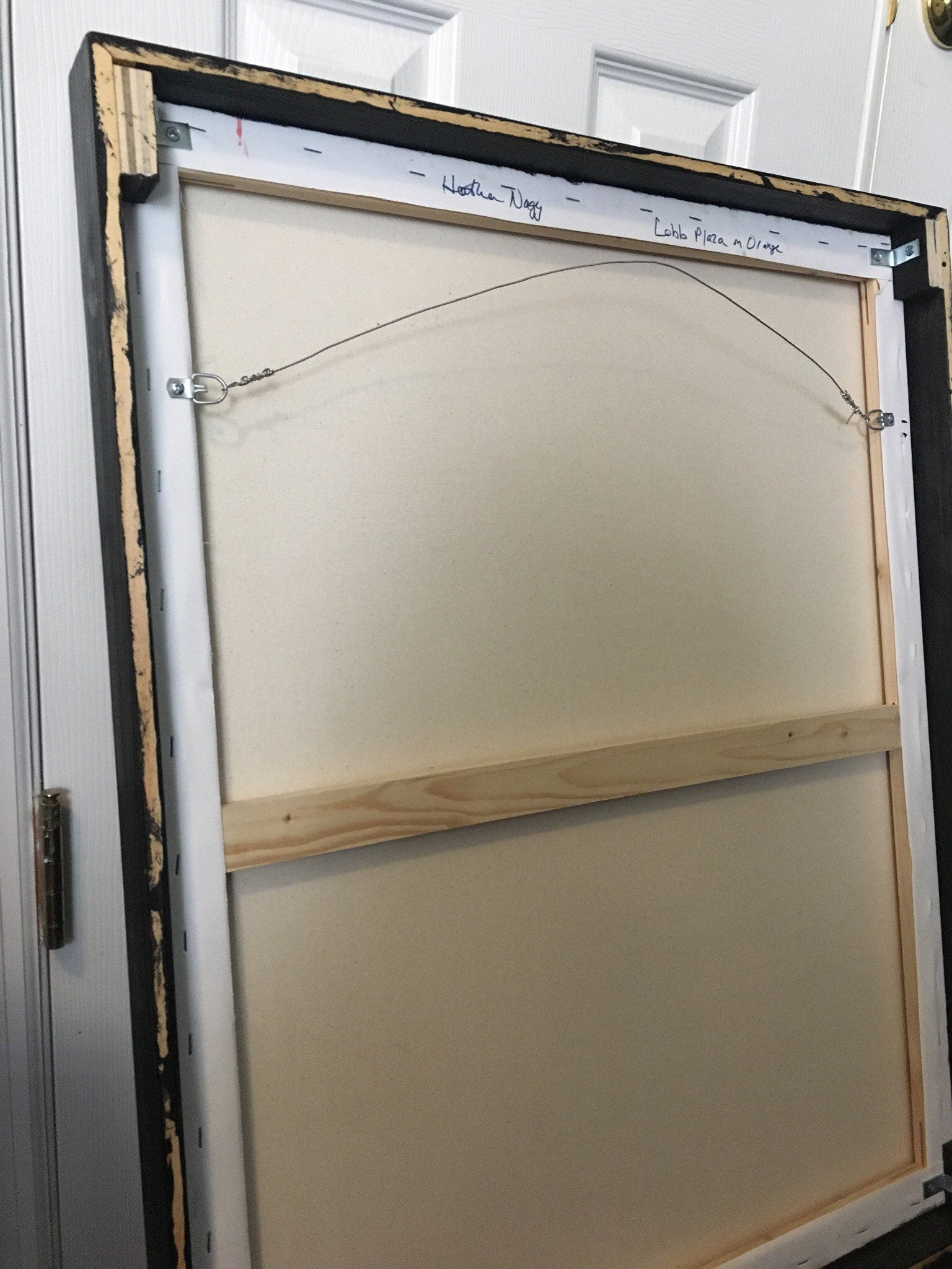 back of framed canvas with wire
