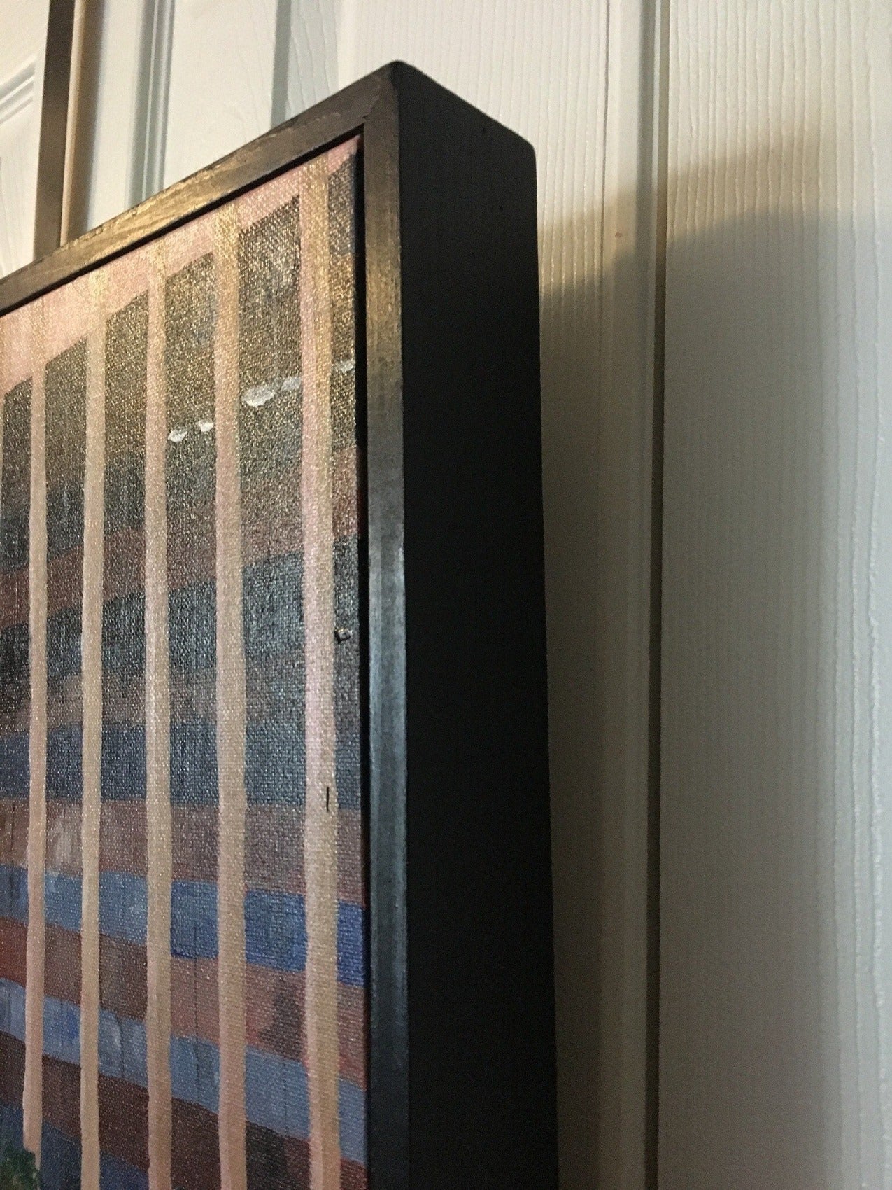 close up of the floating frame and original painting