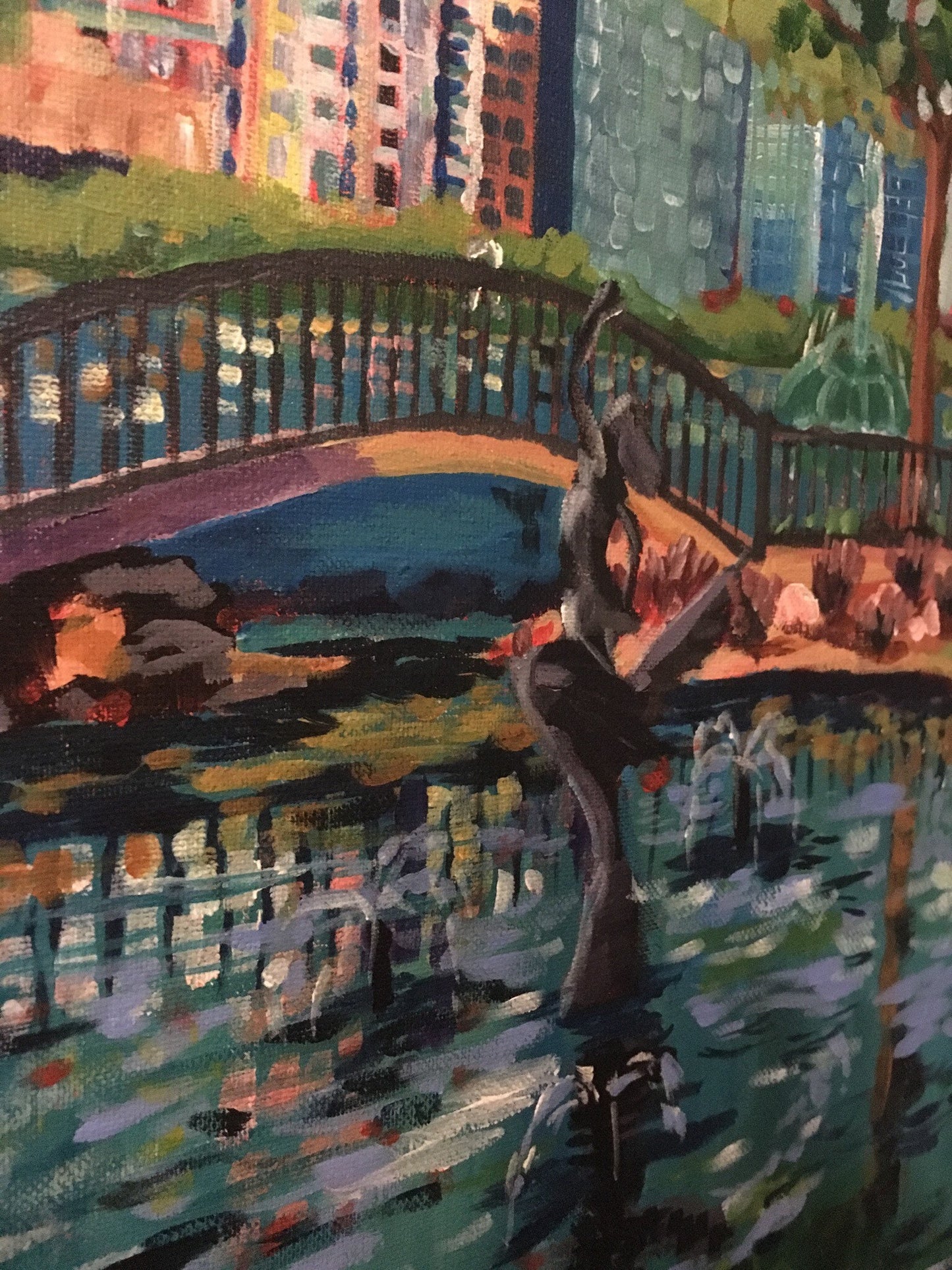 Detail of painting with bridge, buildings and swan princess sculpture