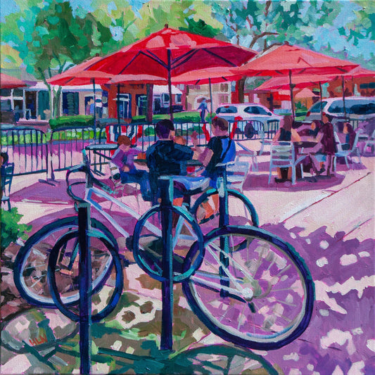 Winter Garden Florida scene of street cafe with red umbrellas and bicycles in impressionistic style