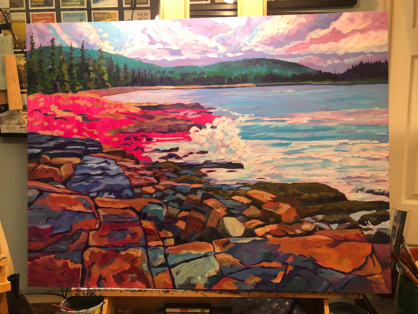 painting in progress in studio on easel with magenta background showing through