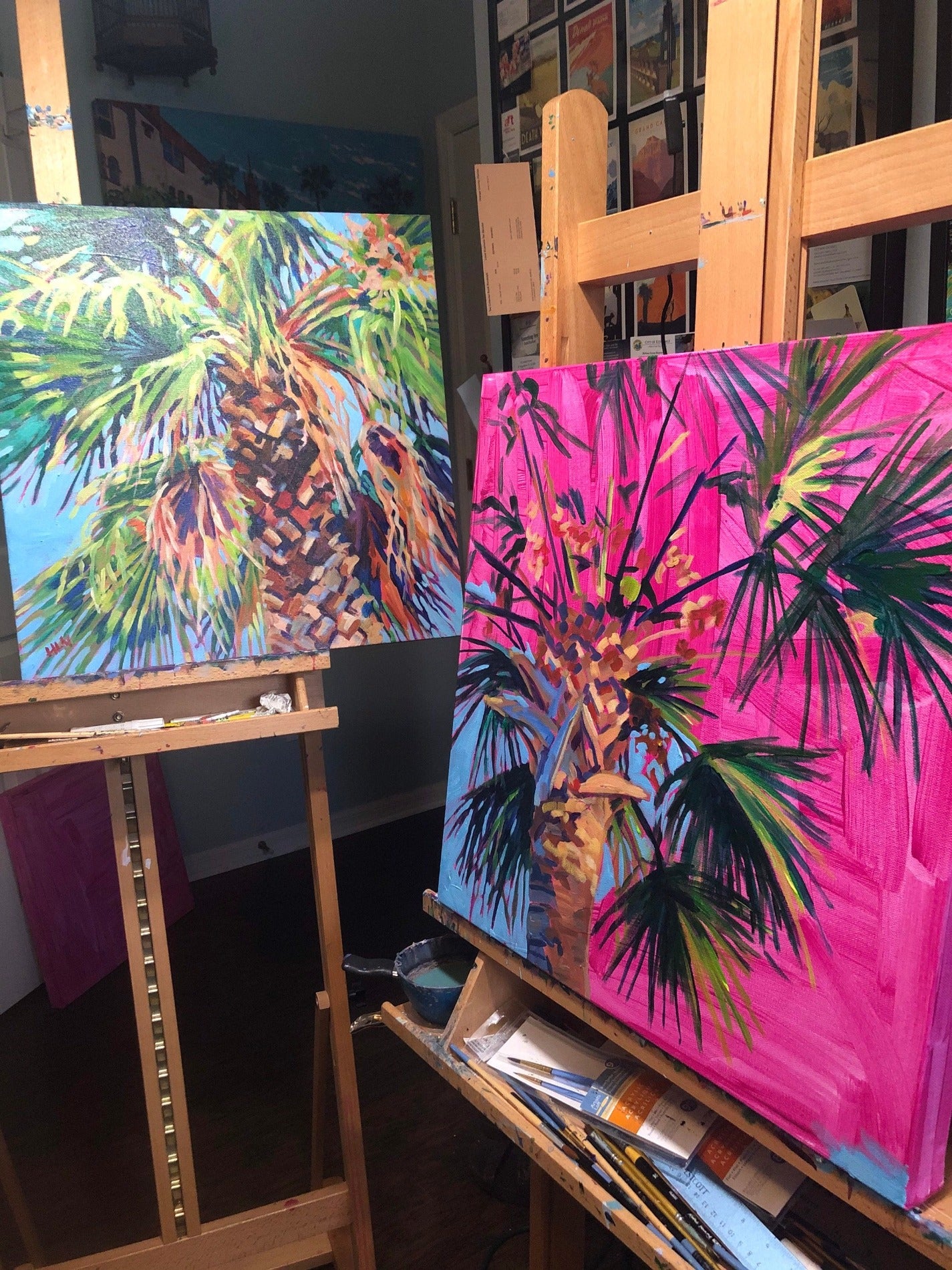 art studio with paintings on easels magenta underwash