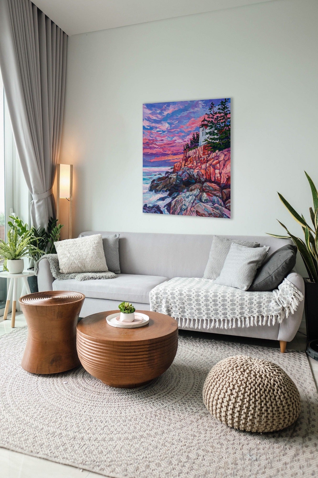 Sunrise lighthouse painting in neutral living room