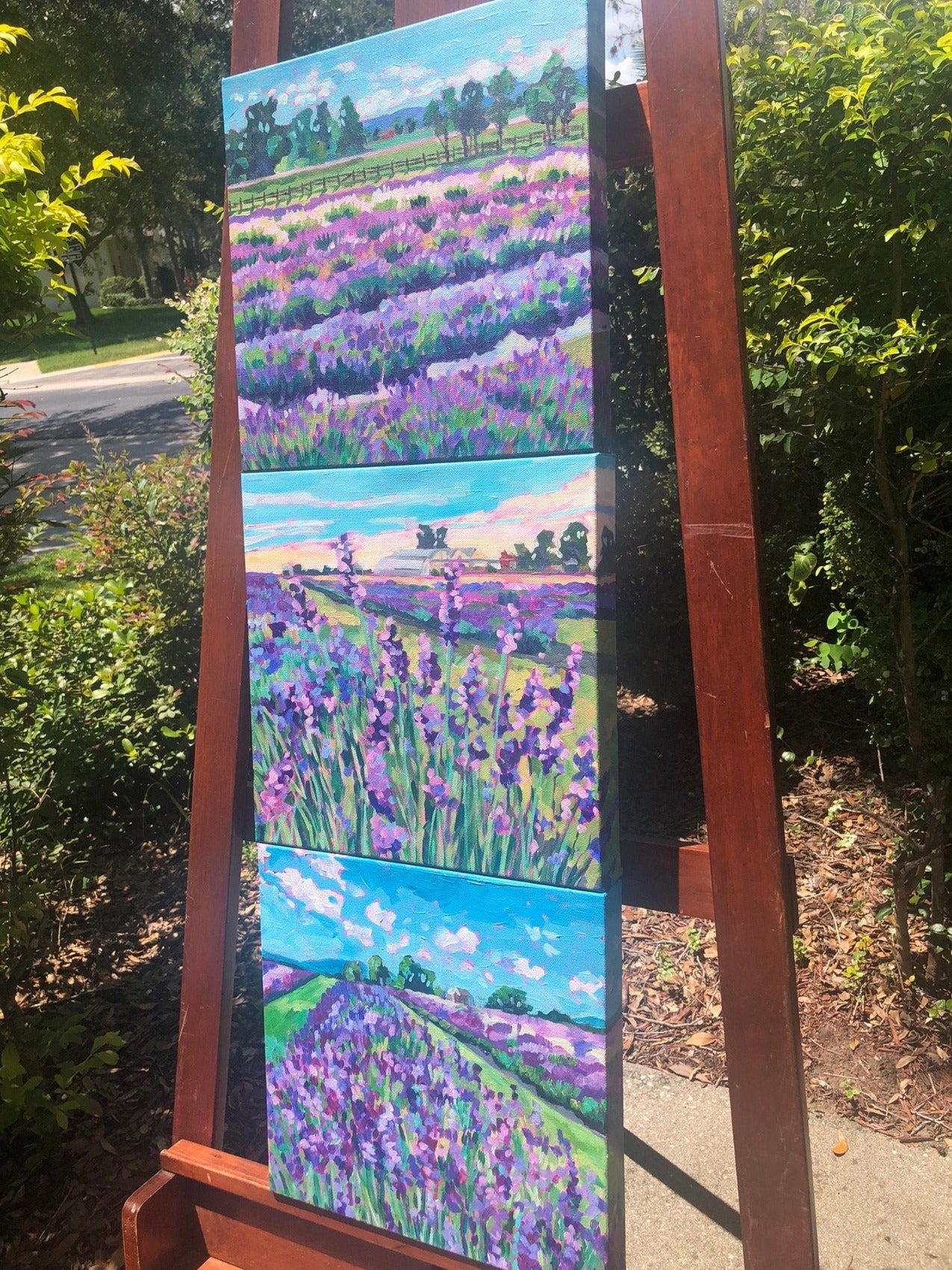 three lavender field painting on easel