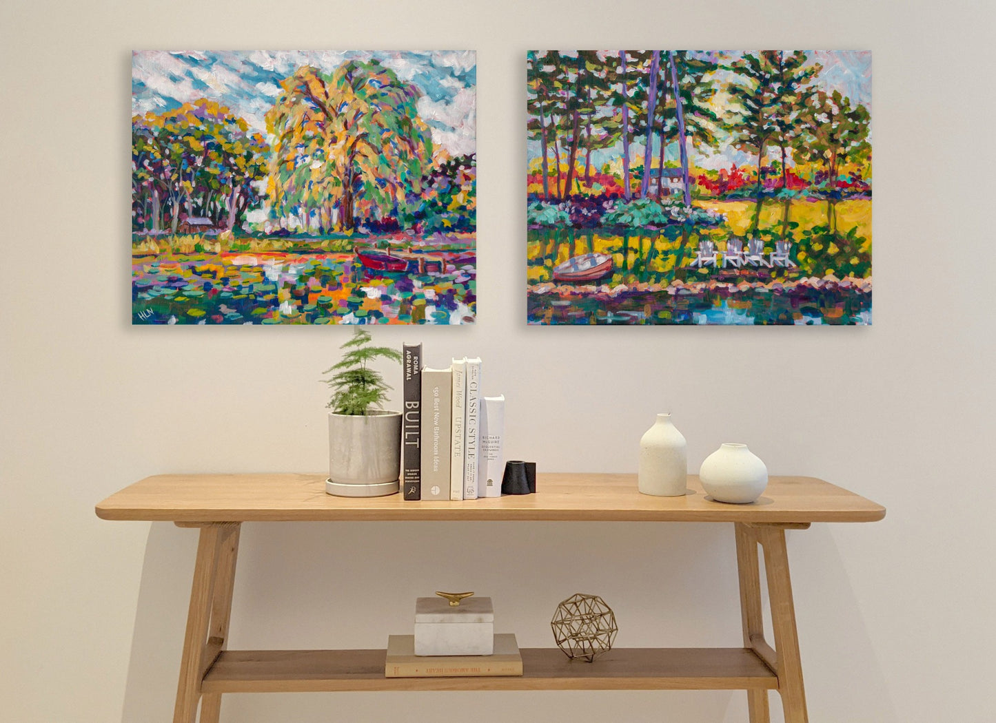 two paintings of lakeshore inspired by chain of lakes in souther Michigan with table