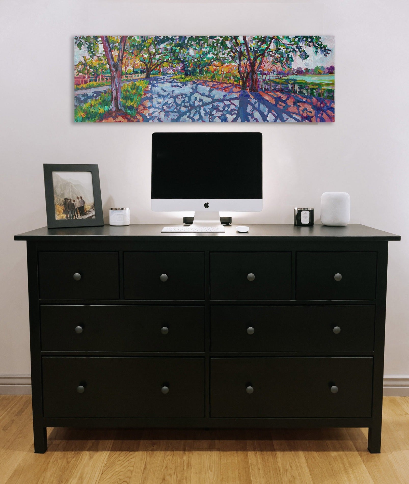 Painting on wall with dresser: Impressionist panoramic painting mature oak trees line street with dramatic shadows at golden hour