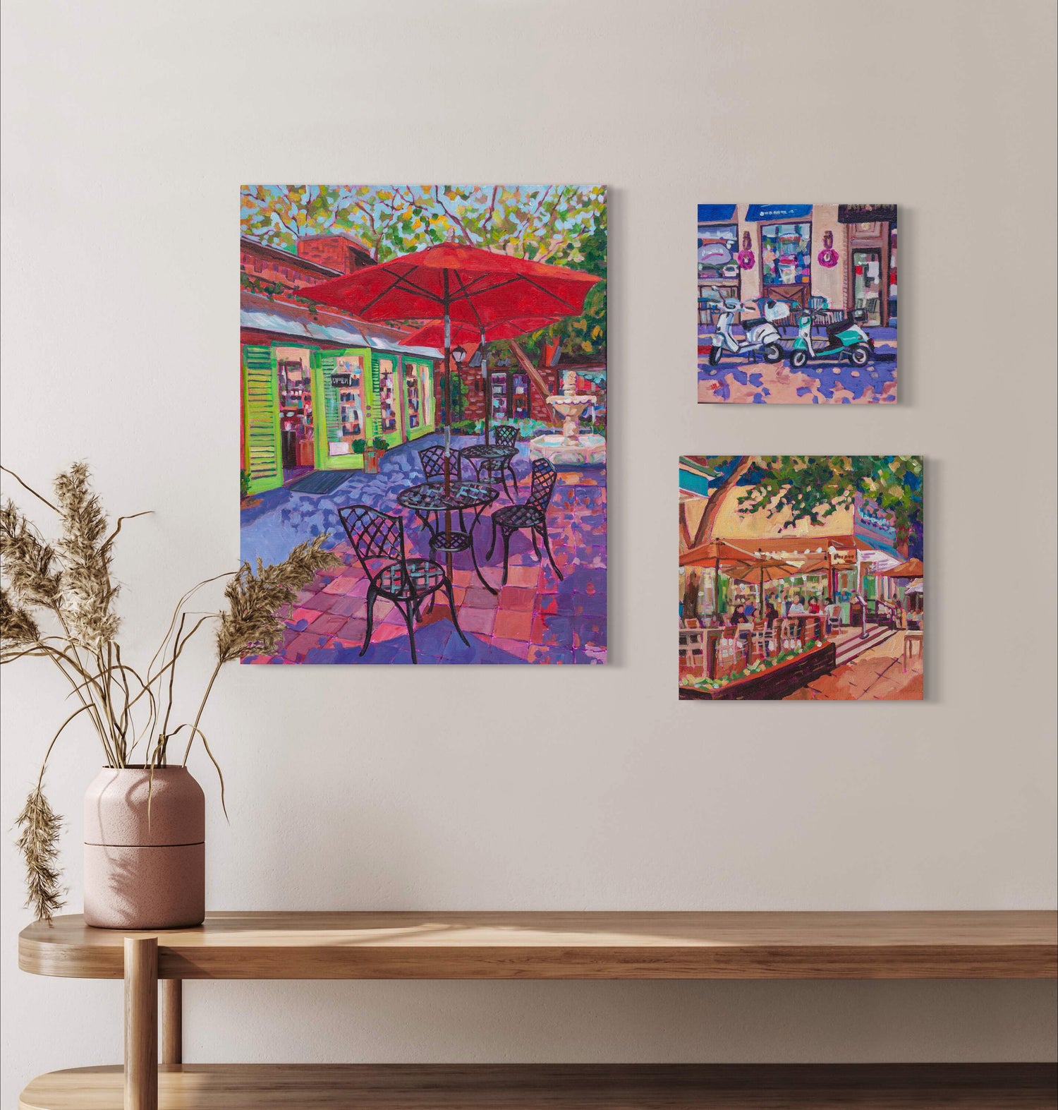grouping of three small town scenes on wall
