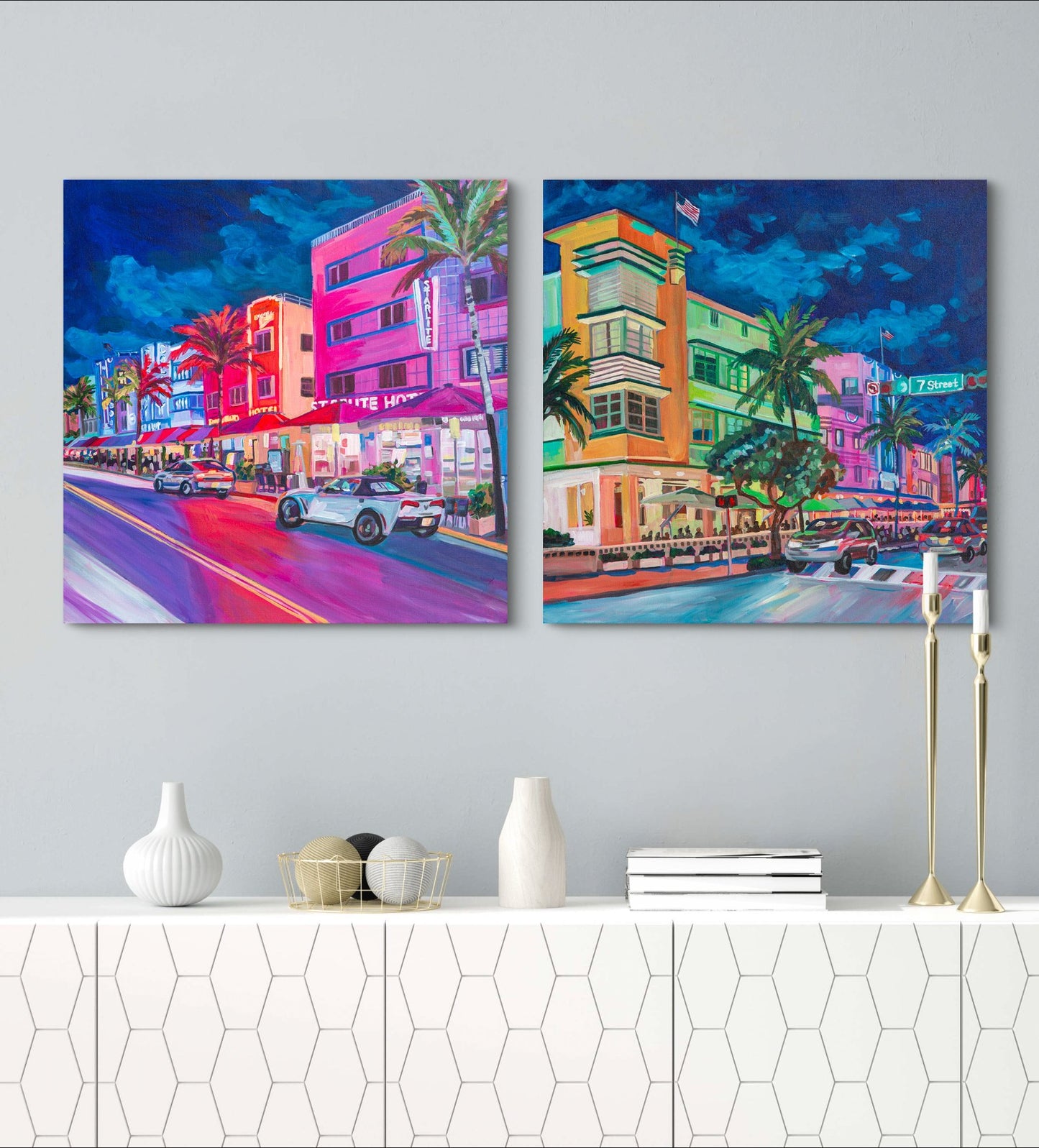 two Miami Beach street scene paintings above a modern white credenza with minimalist decor