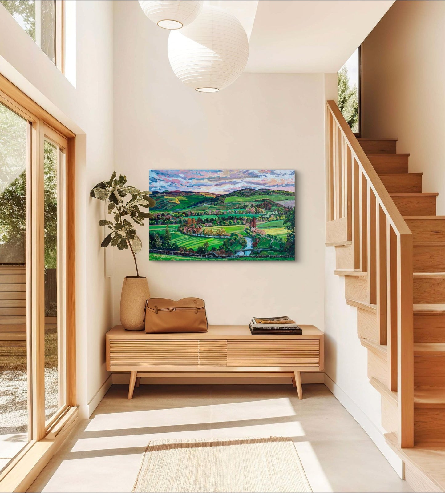 Sunlight room, entry way with wood accents and stairway with focal point of a saturated rural landscape of farmland.