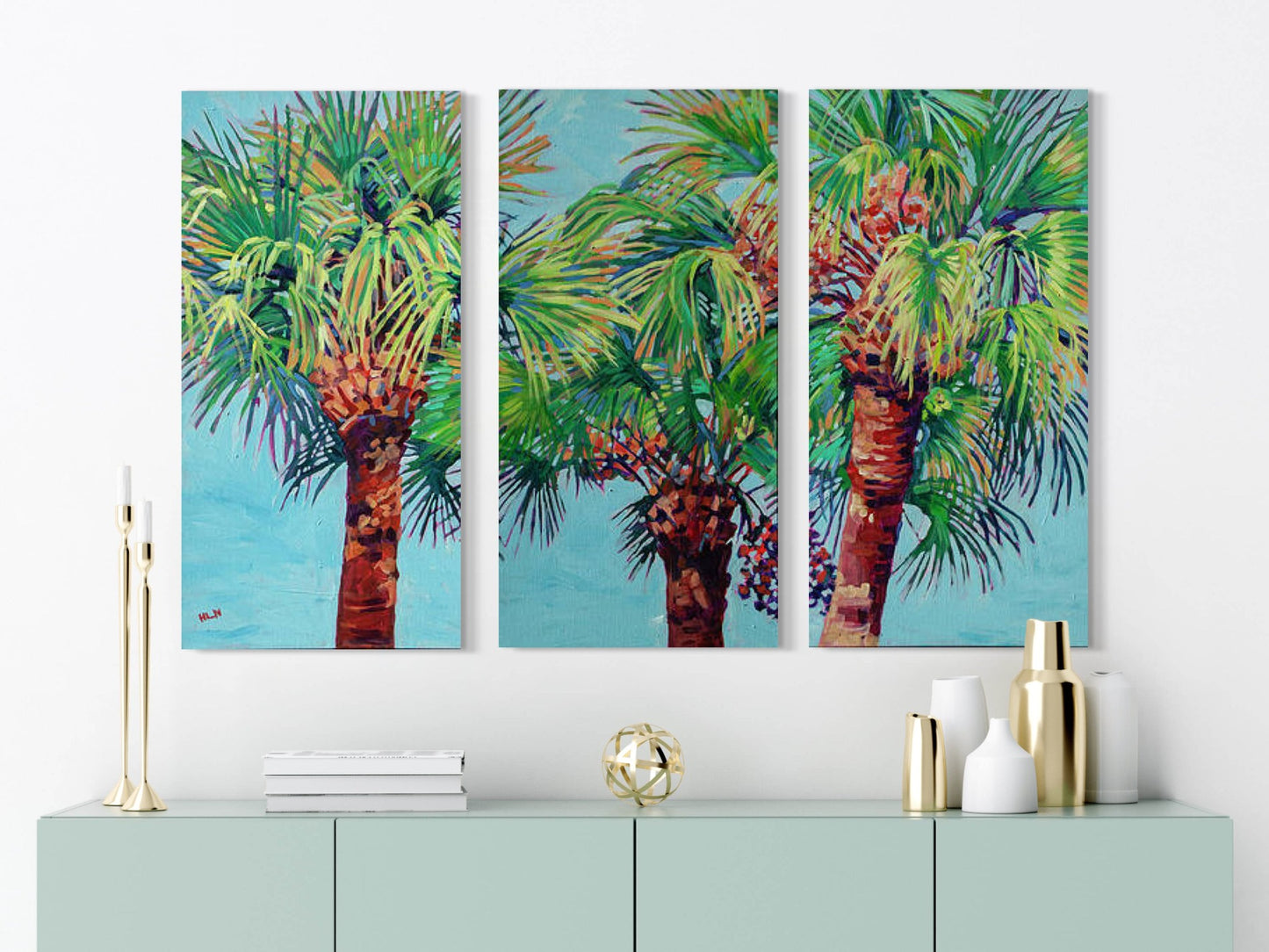 triptych painting of vibrant palm trees on wall