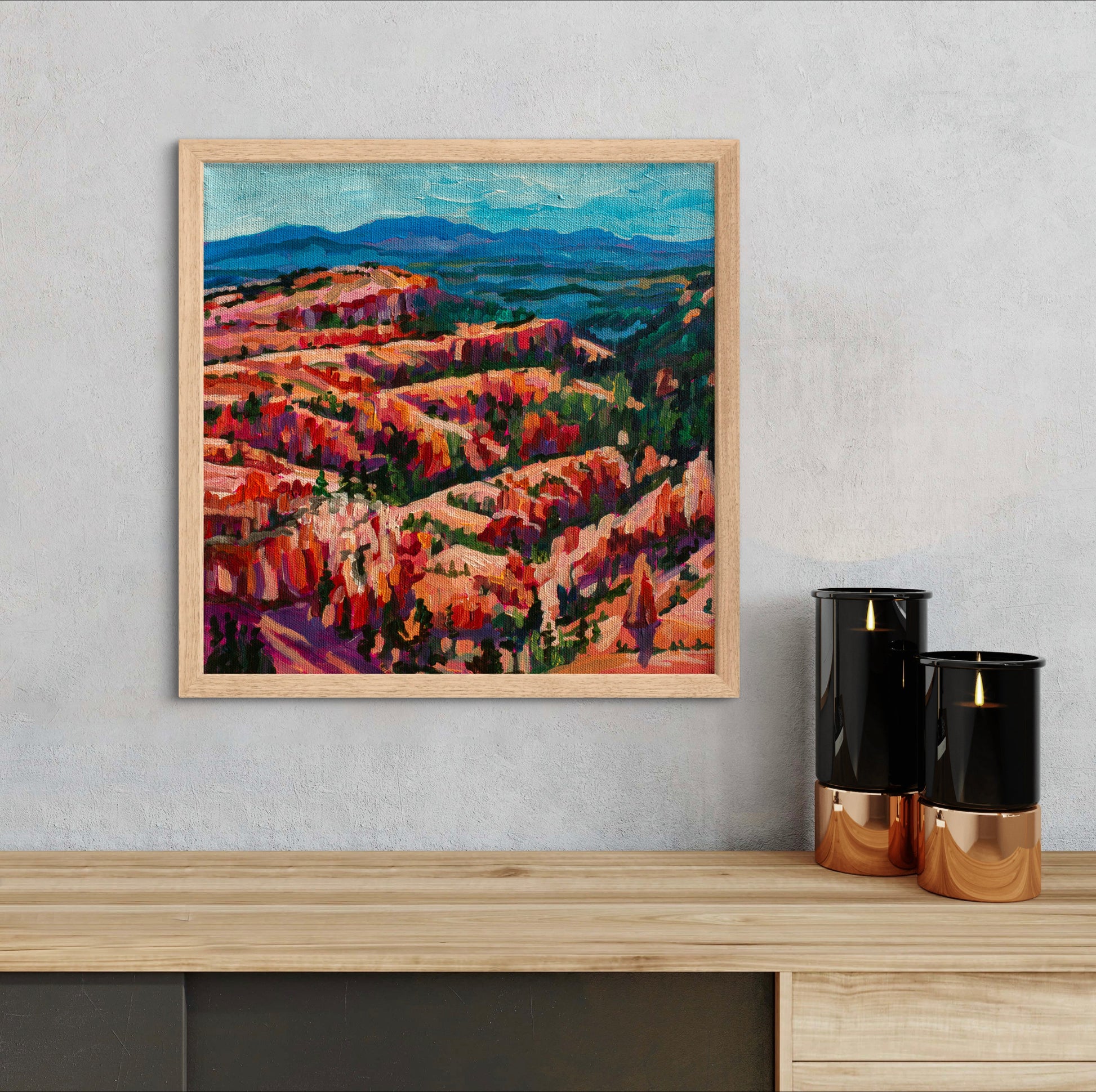 impressionist vibrant acrylic painting of Bryce Canyon National Park in Utah on wall with wood mantle and candles.
