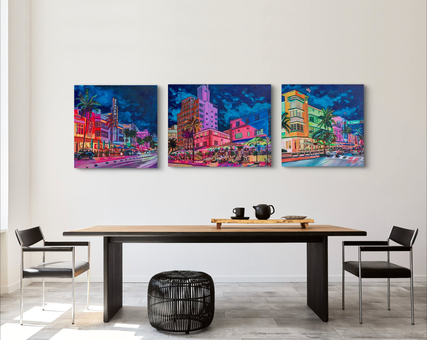 grouping of three street scenes of South Beach Miami with brightly colorful buildings on wall of modern simple dining room.