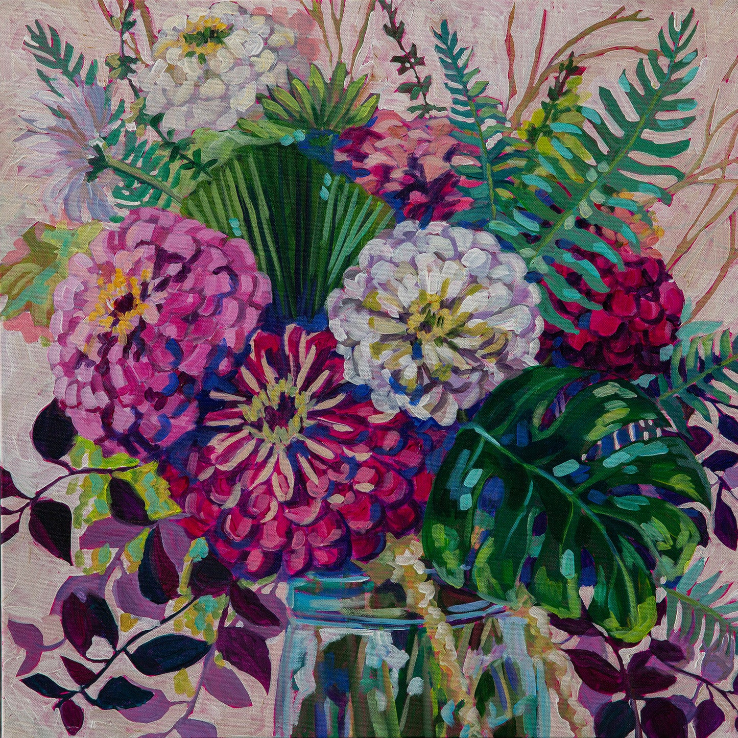 Beautiful bright zinnias of pink, white and magenta in a floral arrangement with ferns, and tropical exotic palm leaves in glass vase and cream background for modern expressive floral still life painting