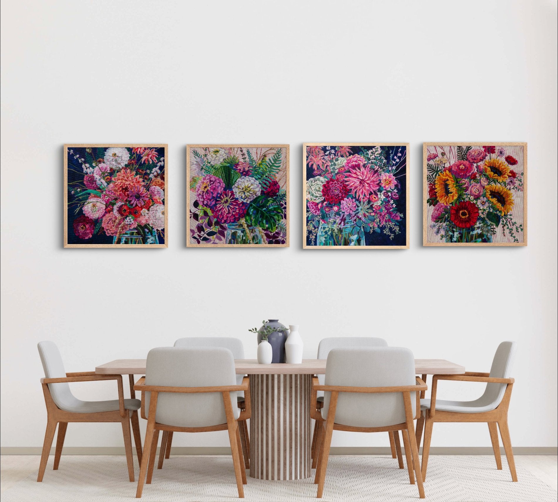 minimalist modern neutral dining room with table and chairs and grouping of 4 modern vibrant floral bouquet still life paintings with bold colors, reds, purples, yellows and navy.