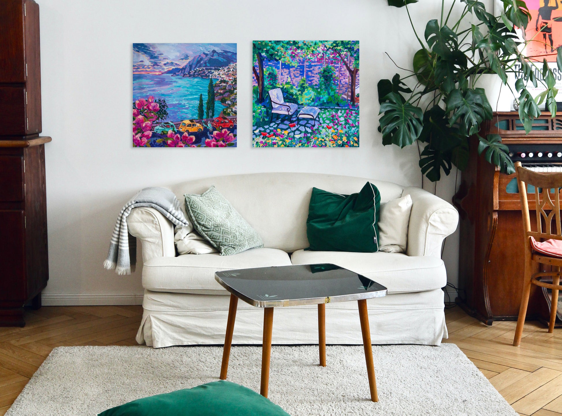 two italian paintings in a living room setting