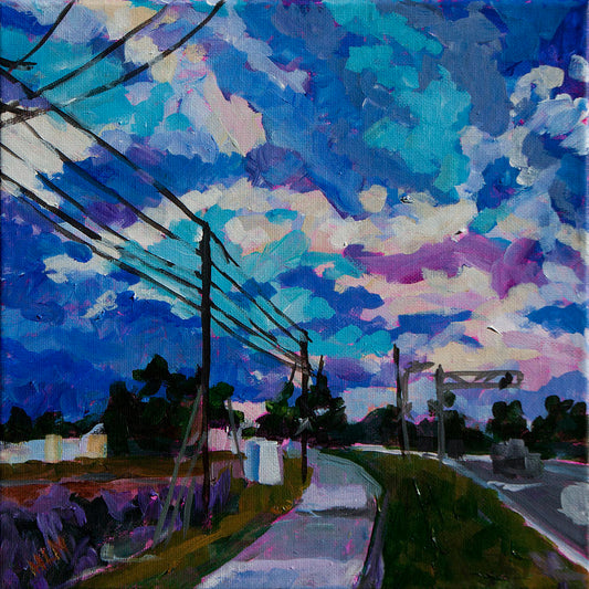 dramatic clouds with sidewalk and powerlines