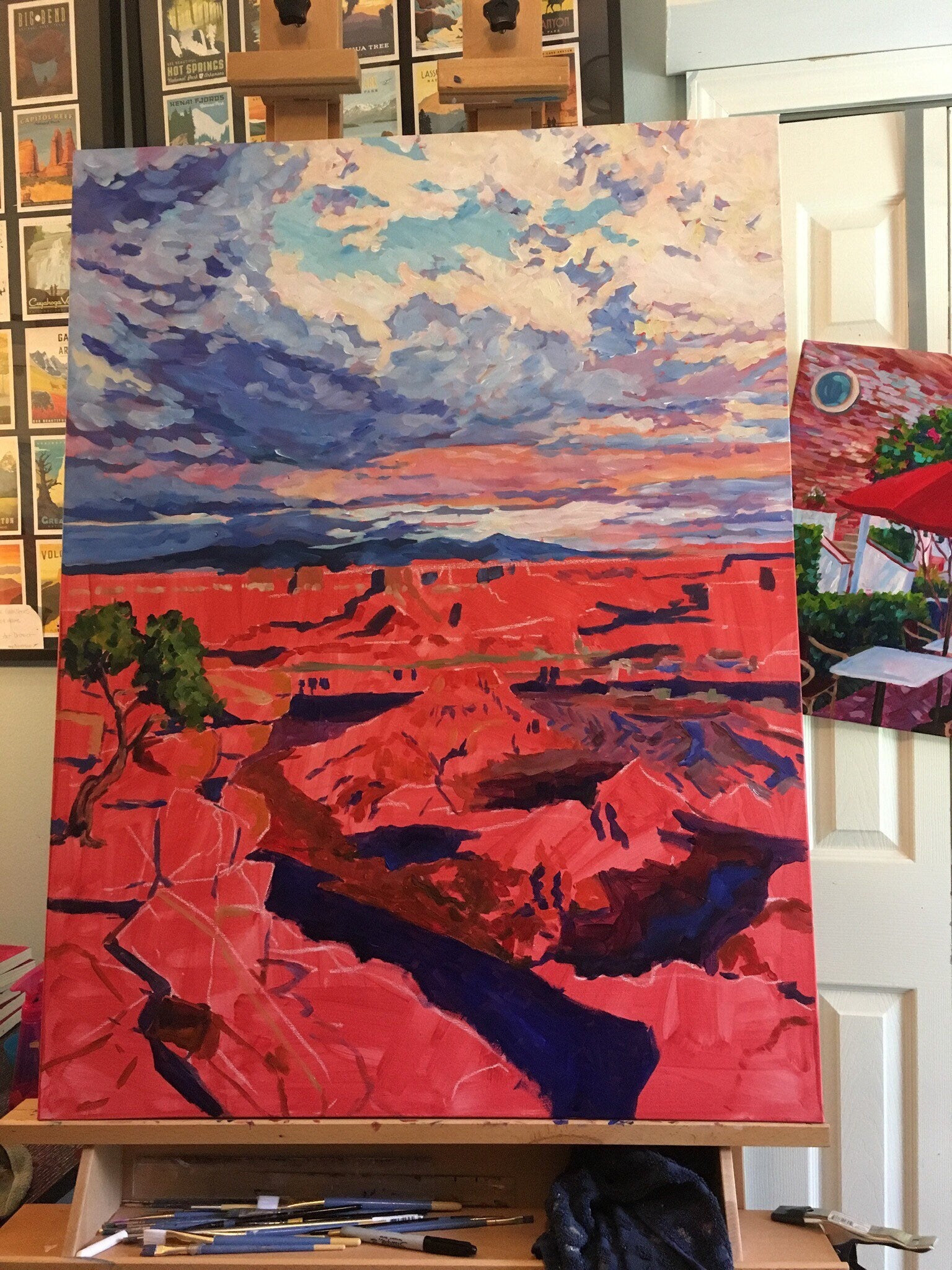 painting in studio in process, sky painted foreground is unpainted- Canyonlands