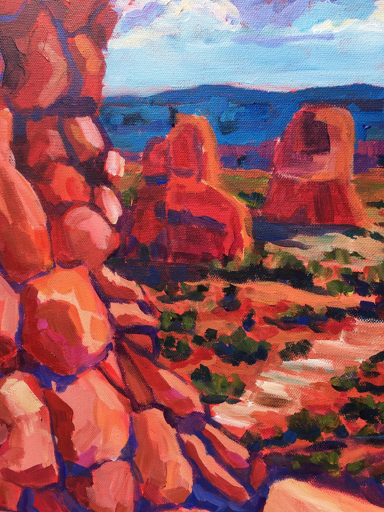 Detail of painting showing red rocks, Utah National Park