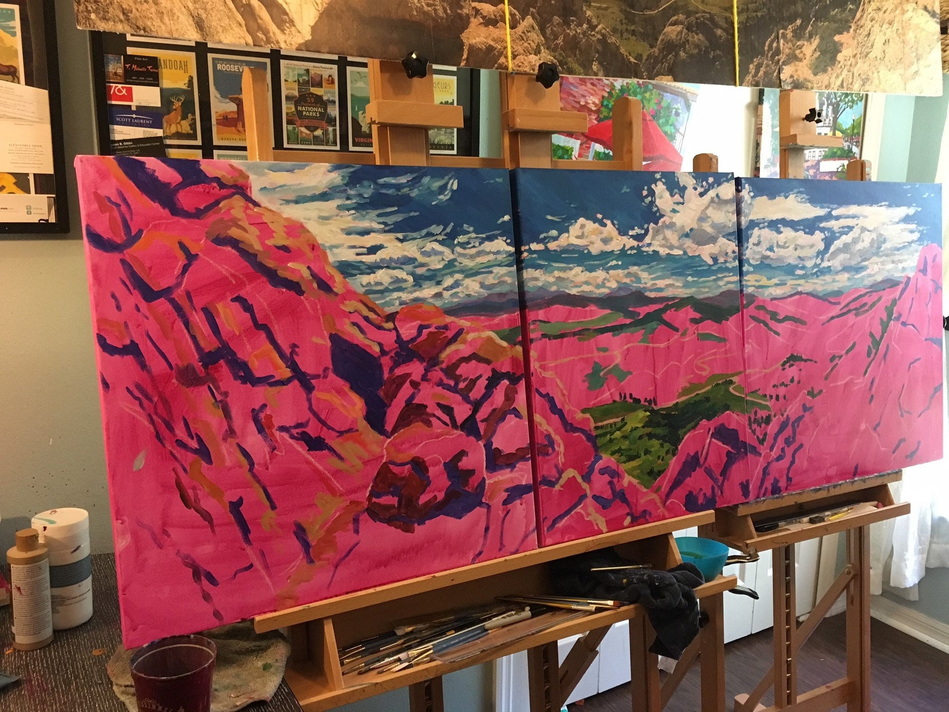 Painting in progress sky painted in studio with magenta undercoat of paint