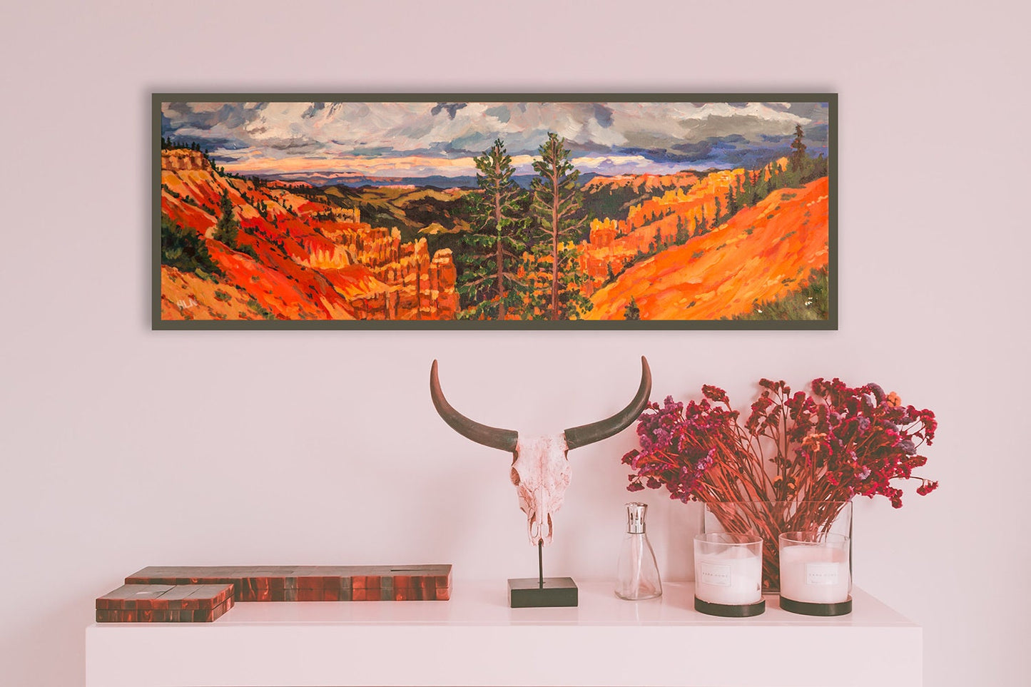 Bryce Canyon National Park painting on wall behind table with miscellaneous items