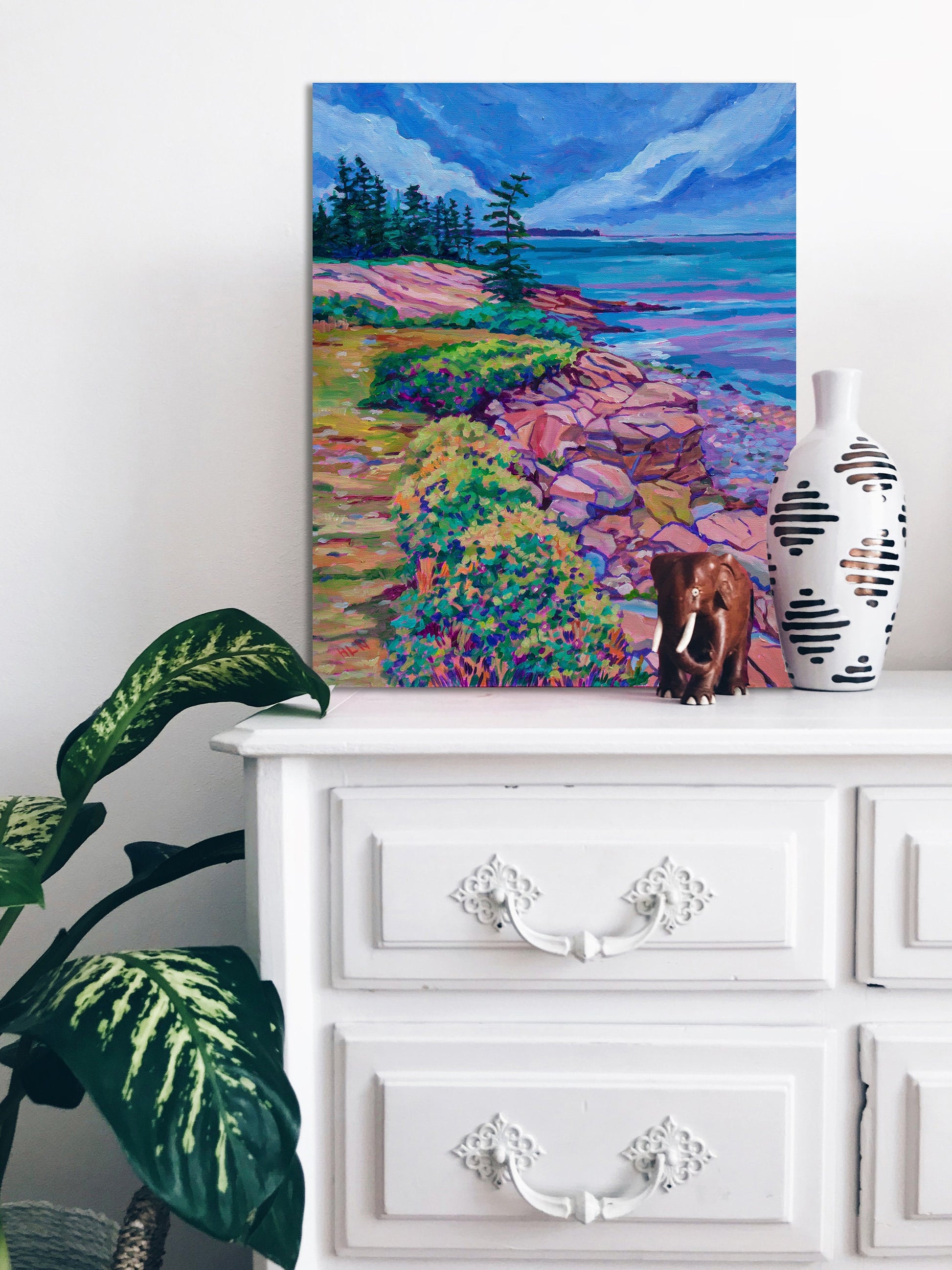 Mount Desert Island coastline painting on dresser with vase