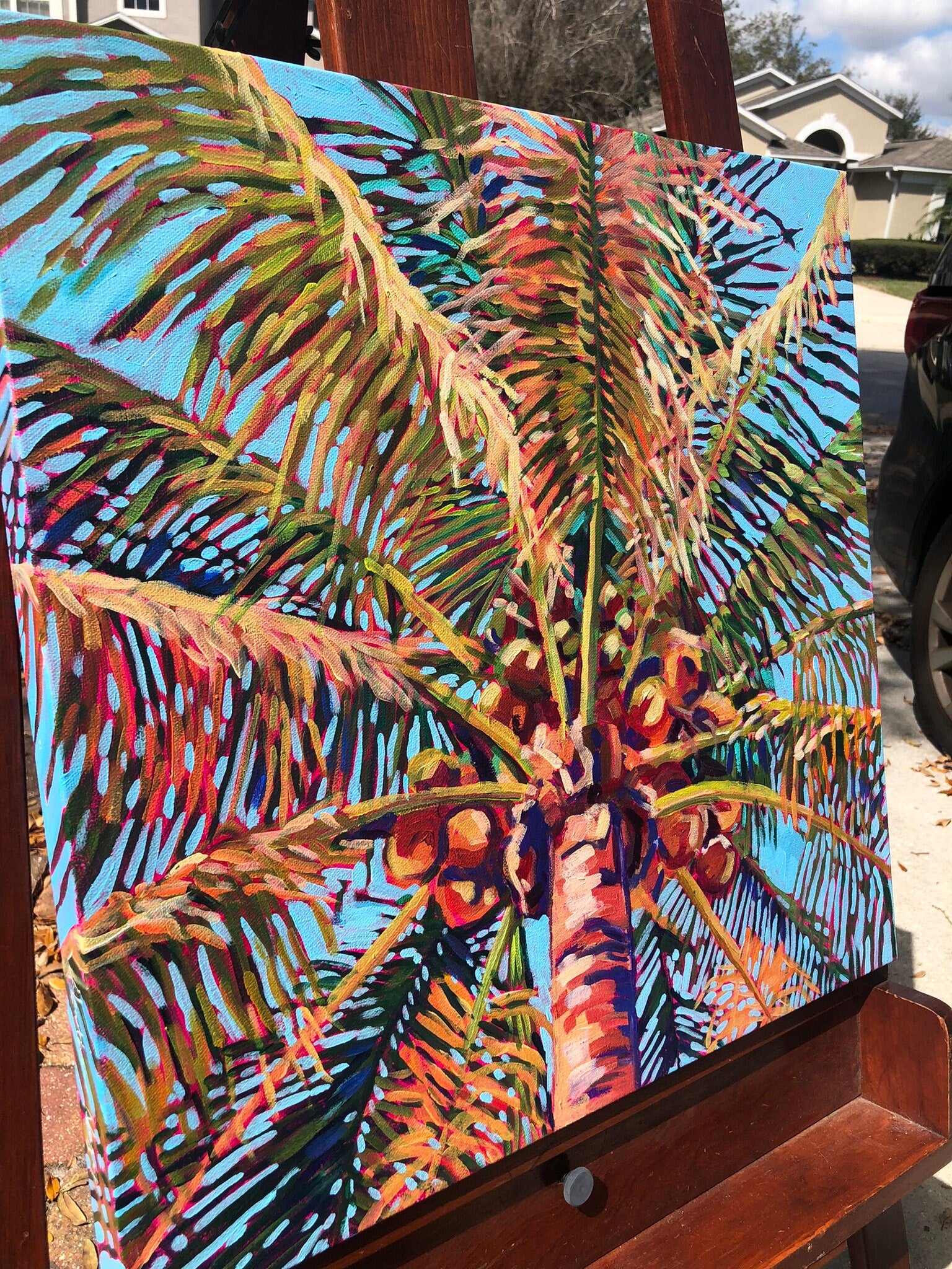 palm tree painting outside on easel