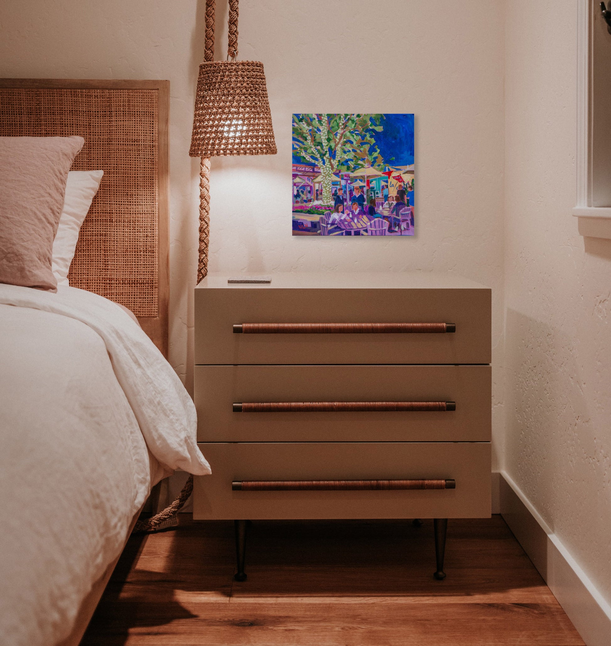 Lake Nona painting in bedroom with nightstand and lamp